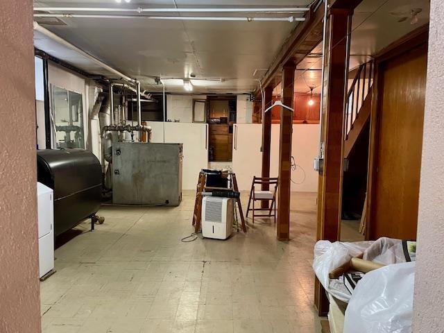 53-80 72nd Pl, Maspeth, NY 11378 - below grade area with oil tank, stairs, and tile patterned floors