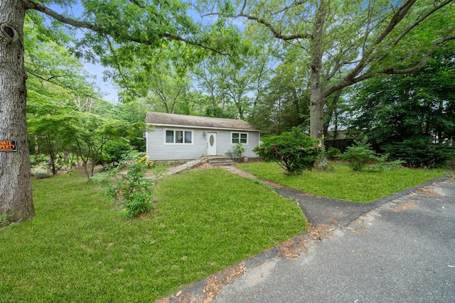 16 Fife Dr, Coram, NY 11727 - view of front of home with a front lawn