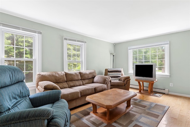 160 Newtown Ln, East Hampton, NY 11937 - living area featuring a baseboard radiator and light wood-style floors