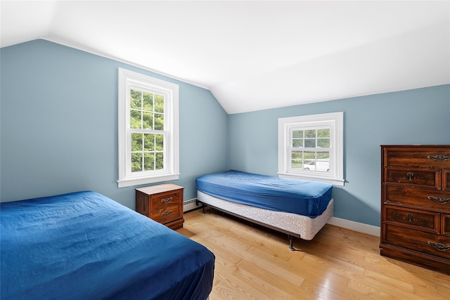 160 Newtown Ln, East Hampton, NY 11937 - bedroom featuring vaulted ceiling, multiple windows, light wood-type flooring, and a baseboard radiator