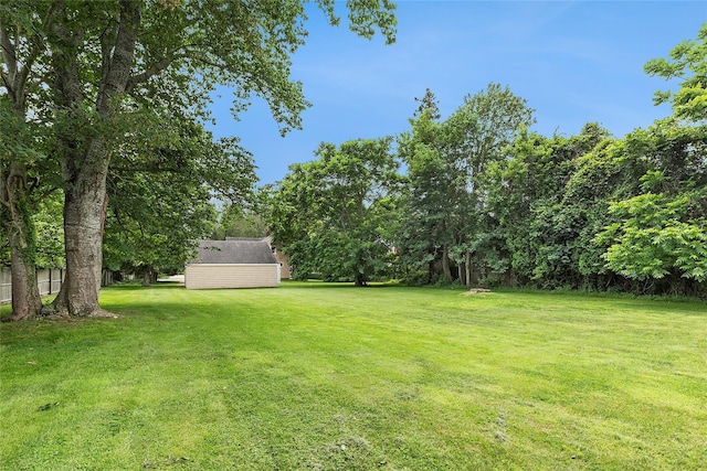 160 Newtown Ln, East Hampton, NY 11937 - view of grassy yard with a shed