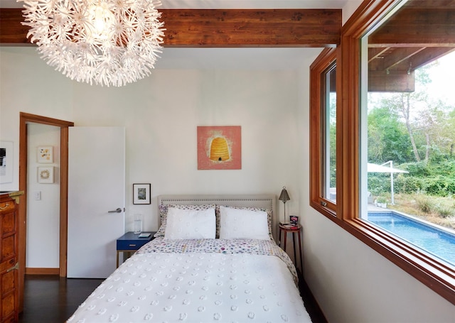 34 Old Neck Rd S, Center Moriches, NY 11934 - bedroom featuring a chandelier and wood finished floors