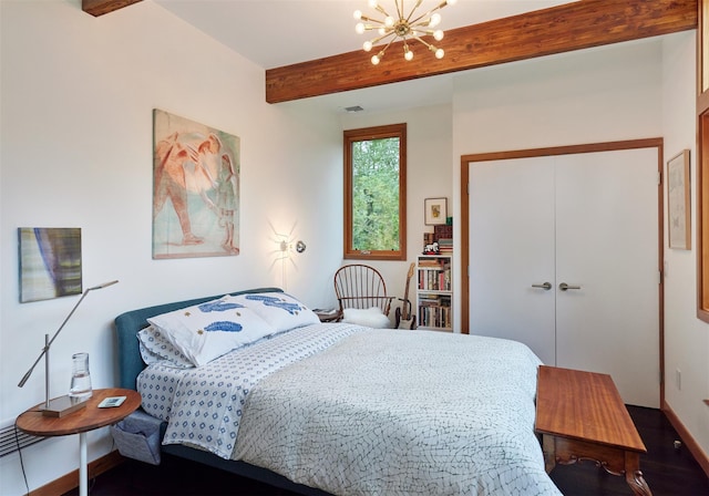 34 Old Neck Rd S, Center Moriches, NY 11934 - bedroom with a chandelier, beam ceiling, and a closet