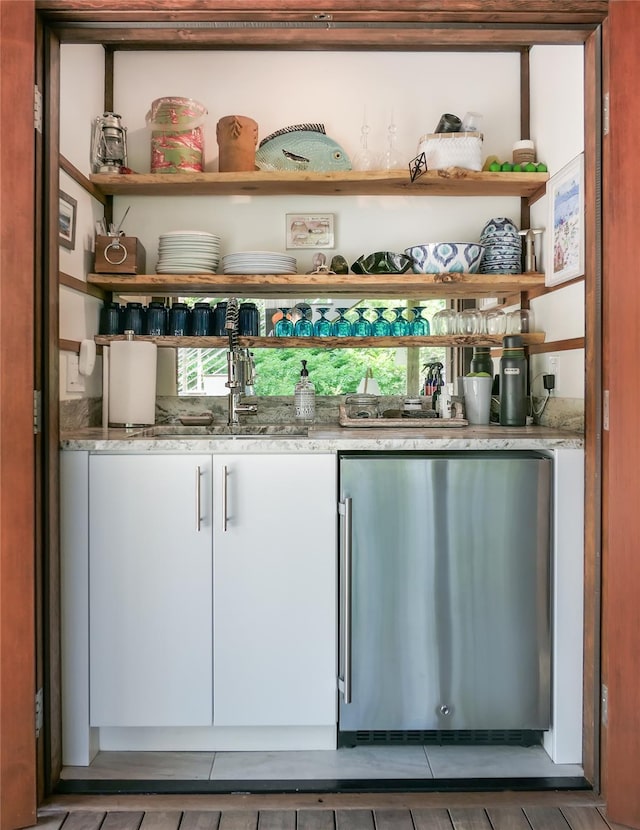 34 Old Neck Rd S, Center Moriches, NY 11934 - indoor wet bar featuring refrigerator and tile patterned flooring