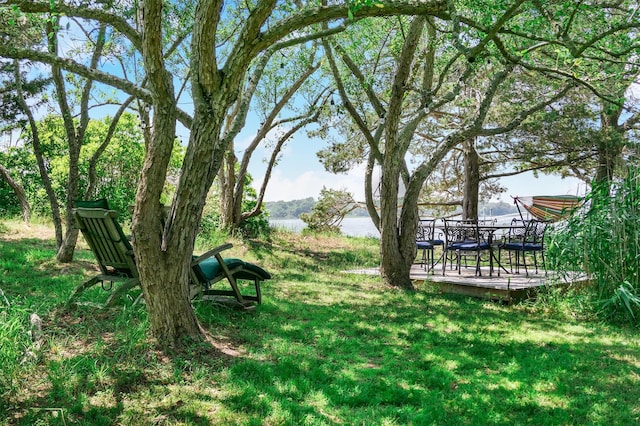 34 Old Neck Rd S, Center Moriches, NY 11934 - view of green lawn featuring a wooden deck and outdoor dining space
