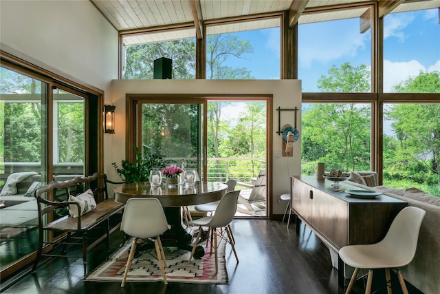 34 Old Neck Rd S, Center Moriches, NY 11934 - dining room featuring a towering ceiling, dark wood-style flooring, and beamed ceiling