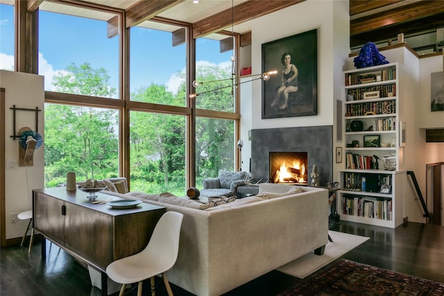 34 Old Neck Rd S, Center Moriches, NY 11934 - living area featuring a premium fireplace, wood finished floors, and beamed ceiling