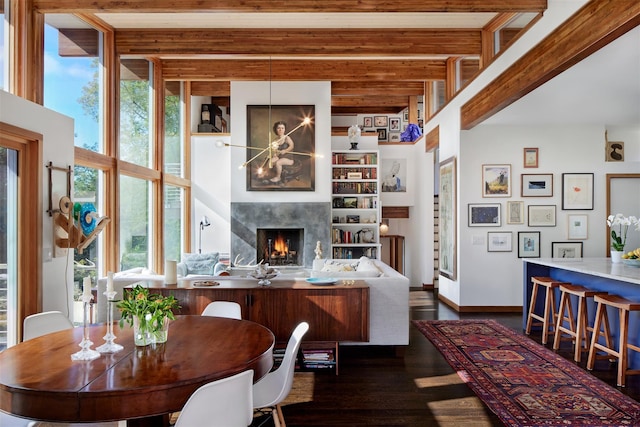 34 Old Neck Rd S, Center Moriches, NY 11934 - dining area with wood finished floors, beamed ceiling, and a high end fireplace