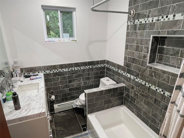 20 Pine Ave, Ossining, NY 10562 - bathroom featuring a baseboard radiator, tile walls, vanity, a bath, and wainscoting