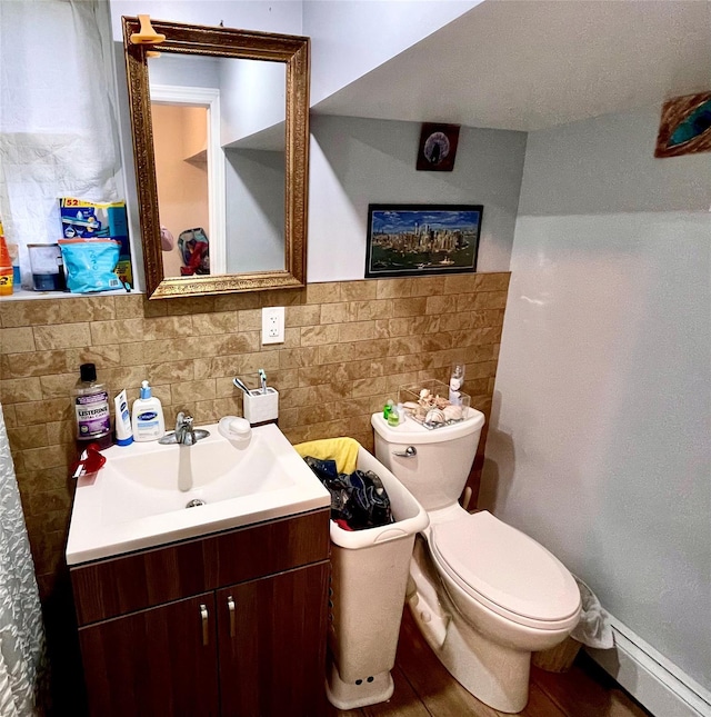 20 Pine Ave, Ossining, NY 10562 - bathroom featuring vanity, baseboard heating, and backsplash