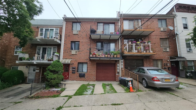 5323 82nd St, Elmhurst, NY 11373 - view of property featuring a garage and driveway