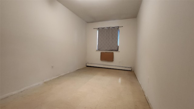 5323 82nd St, Elmhurst, NY 11373 - empty room featuring baseboard heating and tile patterned floors