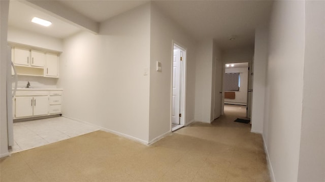 5323 82nd St, Elmhurst, NY 11373 - hall with a sink and a baseboard radiator