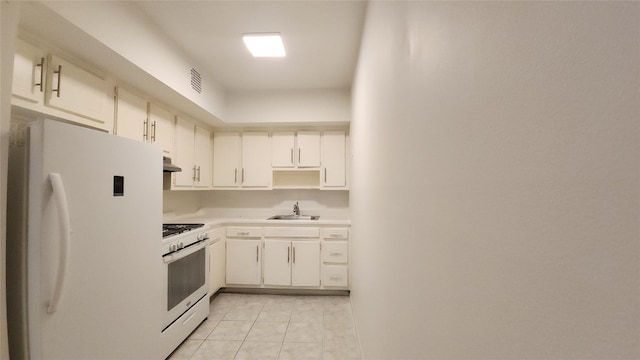 5323 82nd St, Elmhurst, NY 11373 - kitchen featuring white appliances, light tile patterned floors, light countertops, under cabinet range hood, and white cabinets