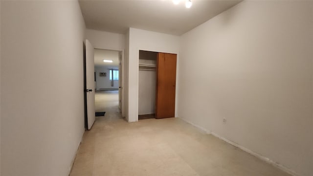 5323 82nd St, Elmhurst, NY 11373 - unfurnished bedroom featuring a closet, light colored carpet, and a baseboard heating unit