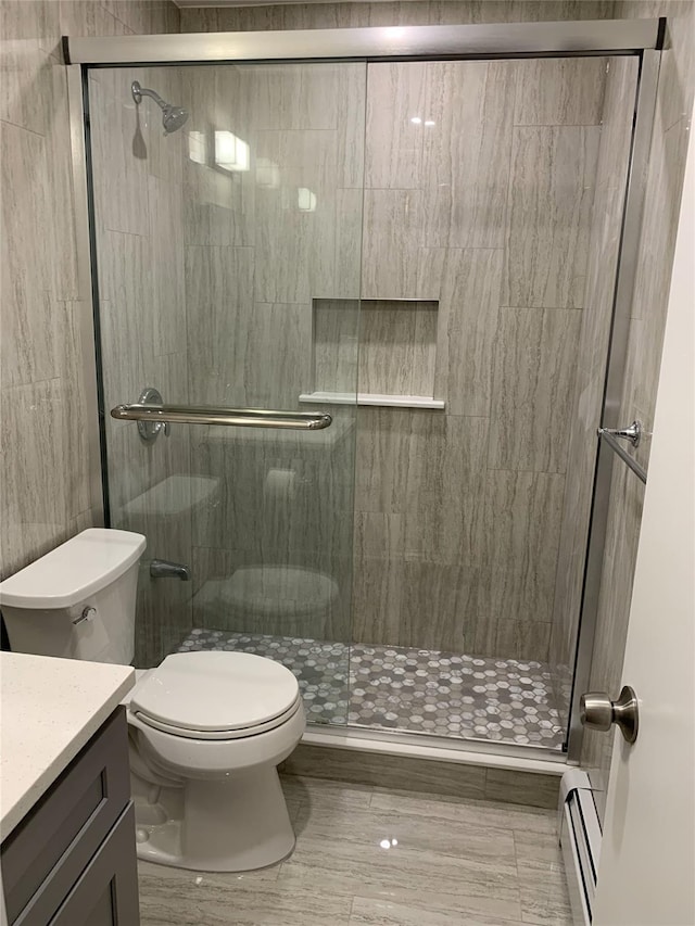 5323 82nd St, Elmhurst, NY 11373 - bathroom featuring a baseboard radiator, vanity, and a stall shower