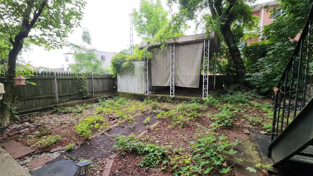 5323 82nd St, Elmhurst, NY 11373 - fenced backyard with a storage shed