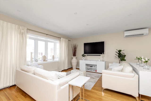 1159 129th St, College Point, NY 11356 - living area with a wall mounted air conditioner and light wood finished floors