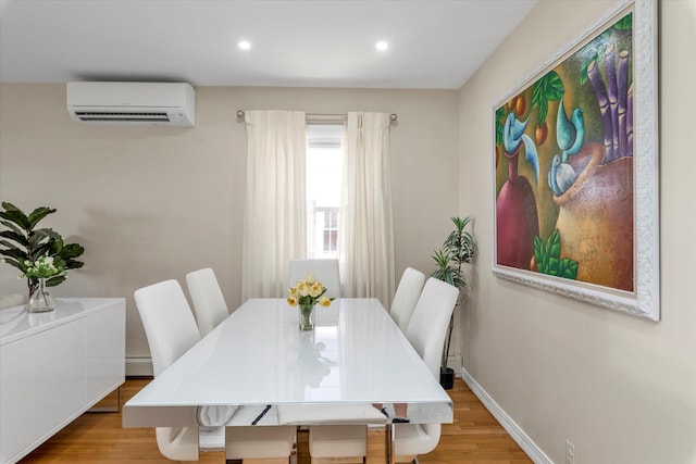 1159 129th St, College Point, NY 11356 - dining area with an AC wall unit, light wood finished floors, recessed lighting, and a baseboard radiator