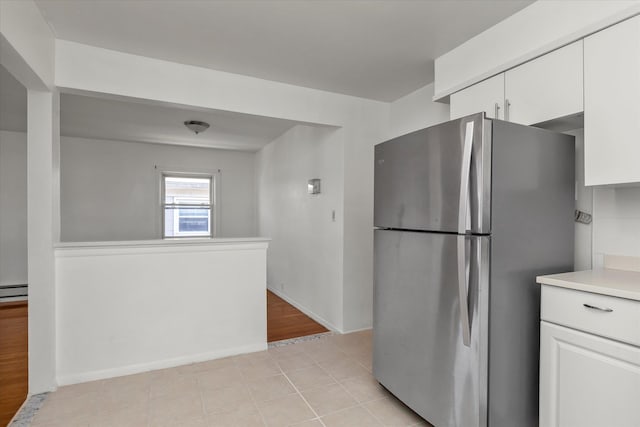 1159 129th St, College Point, NY 11356 - kitchen featuring freestanding refrigerator, white cabinets, and light countertops
