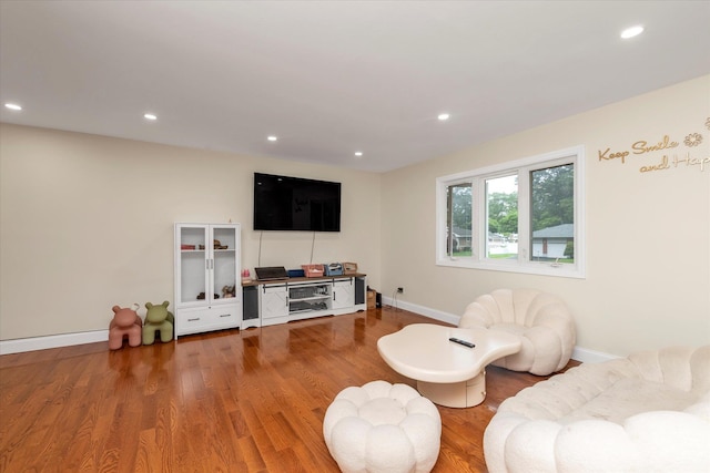 27 Heron Ln, Commack, NY 11725 - living area with wood finished floors and recessed lighting