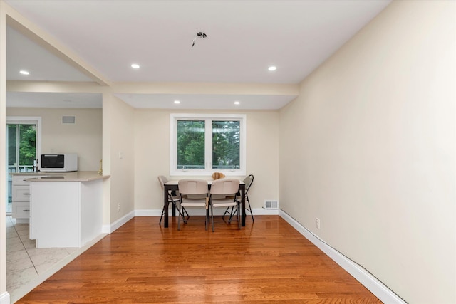 27 Heron Ln, Commack, NY 11725 - dining room with recessed lighting and light wood finished floors