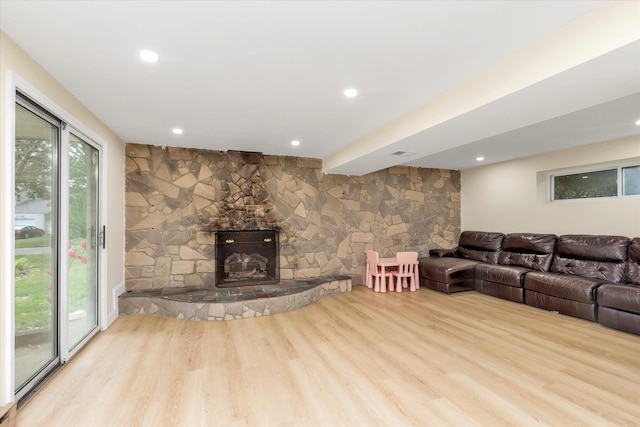 27 Heron Ln, Commack, NY 11725 - living area featuring wood finished floors, a stone fireplace, and recessed lighting