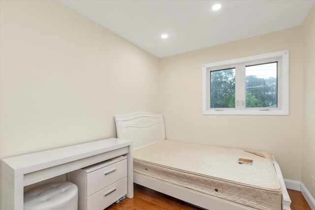 27 Heron Ln, Commack, NY 11725 - bedroom with dark wood-style flooring and recessed lighting