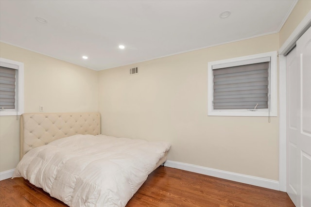 27 Heron Ln, Commack, NY 11725 - bedroom featuring wood finished floors, recessed lighting, and ornamental molding
