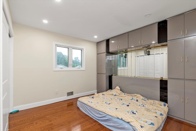 27 Heron Ln, Commack, NY 11725 - bedroom featuring wood finished floors and recessed lighting