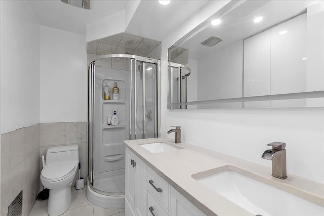 27 Heron Ln, Commack, NY 11725 - full bathroom with a shower stall, double vanity, tile patterned flooring, and tile walls