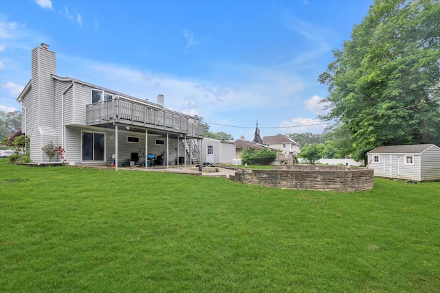 27 Heron Ln, Commack, NY 11725 - rear view of house featuring a wooden deck, a chimney, a lawn, and stairs
