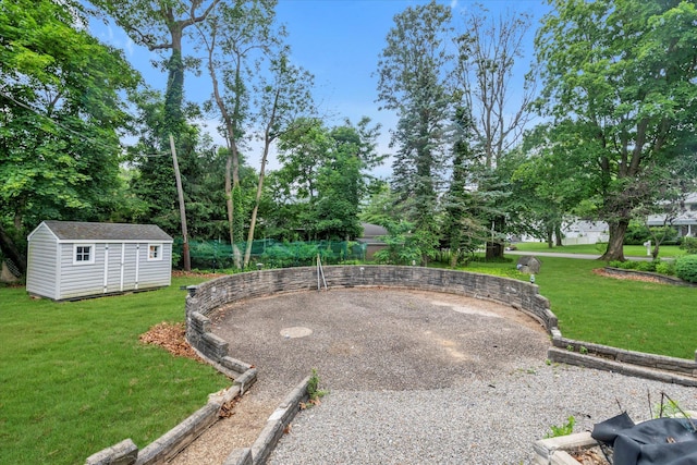 27 Heron Ln, Commack, NY 11725 - view of grassy yard featuring a shed, curved driveway, and view of wooded area