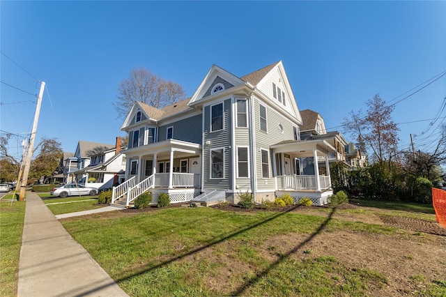 22 Forbus St, Poughkeepsie, NY 12601 - view of front of home with covered porch and a front lawn
