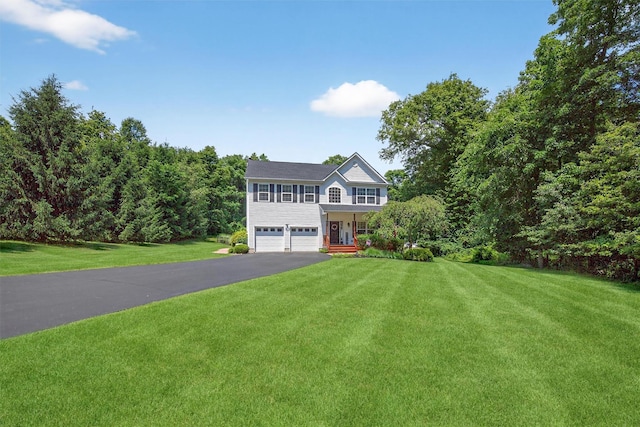 85 Decker Dr, Walden, NY 12586 - view of front facade featuring asphalt driveway, an attached garage, and a front yard