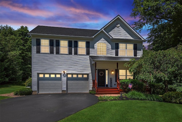 85 Decker Dr, Walden, NY 12586 - view of front of property featuring asphalt driveway, an attached garage, a front lawn, and covered porch