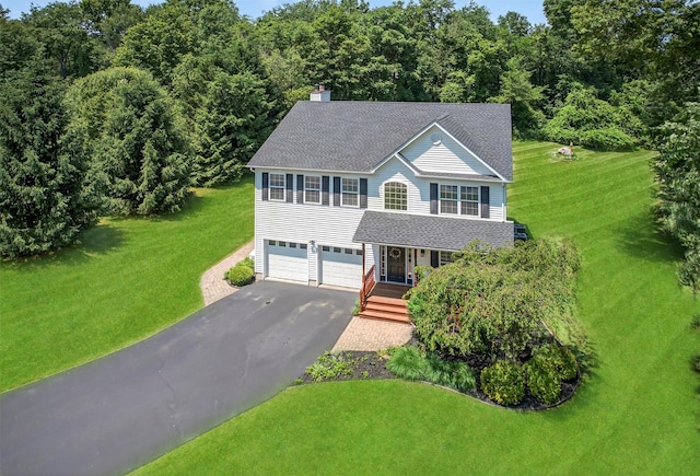 85 Decker Dr, Walden, NY 12586 - view of front of home featuring driveway, a shingled roof, a front yard, and a chimney