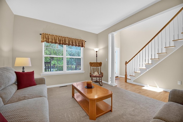85 Decker Dr, Walden, NY 12586 - living area featuring stairs, ornate columns, and wood finished floors