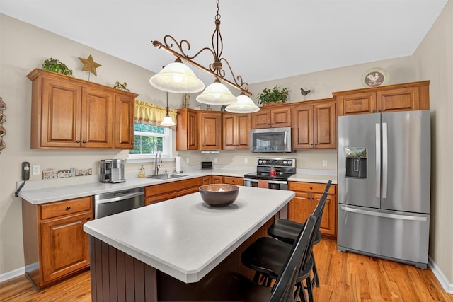 85 Decker Dr, Walden, NY 12586 - kitchen featuring appliances with stainless steel finishes, brown cabinets, light countertops, and light wood-style flooring