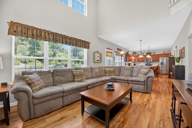 85 Decker Dr, Walden, NY 12586 - living area with a high ceiling and light wood-style flooring