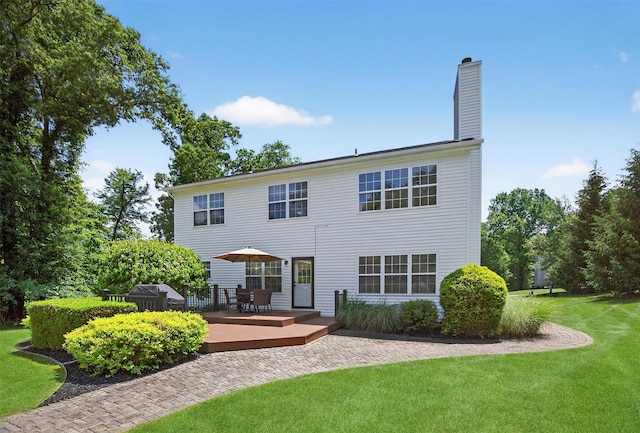 85 Decker Dr, Walden, NY 12586 - back of house featuring a wooden deck, a lawn, a chimney, and outdoor dining space