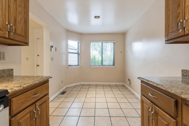 175 Horseshoe Cir, Ossining, NY 10562 - kitchen featuring brown cabinets and light stone counters
