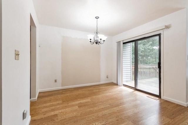 175 Horseshoe Cir, Ossining, NY 10562 - unfurnished room with a chandelier and light wood finished floors