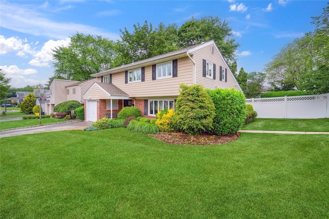 9 Elaine Pl, Plainview, NY 11803 - view of front of property with asphalt driveway and an attached garage