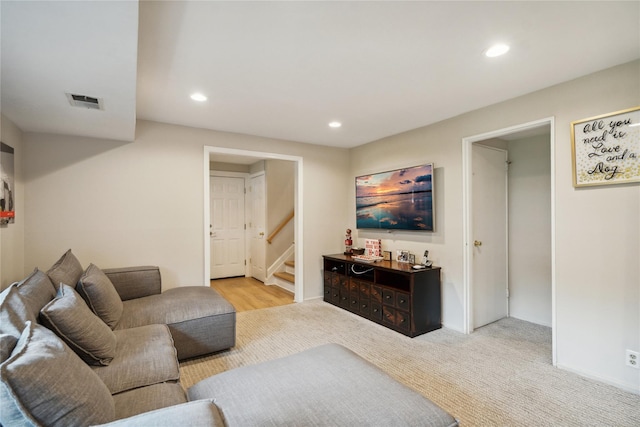 9 Elaine Pl, Plainview, NY 11803 - carpeted living area with stairs and recessed lighting