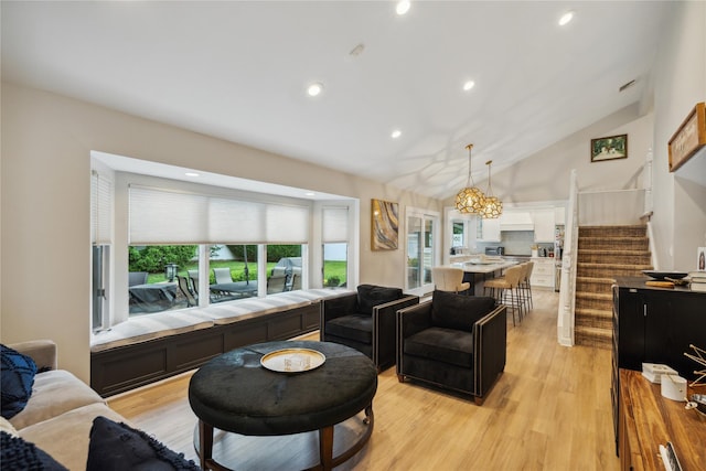 9 Elaine Pl, Plainview, NY 11803 - living room with stairway, vaulted ceiling, light wood-style flooring, and recessed lighting