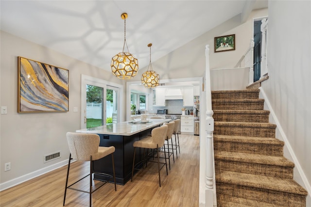 9 Elaine Pl, Plainview, NY 11803 - dining room featuring stairway and light wood finished floors