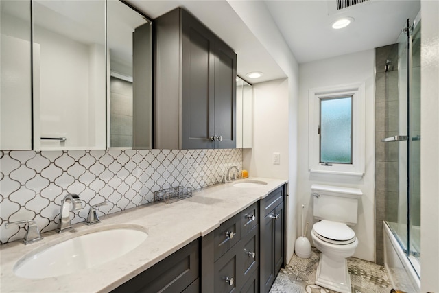 9 Elaine Pl, Plainview, NY 11803 - bathroom with double vanity, backsplash, shower / bath combination with glass door, tile patterned floors, and recessed lighting