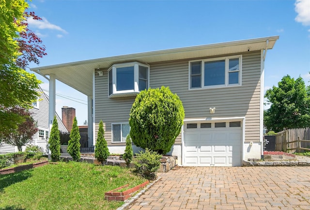 7 Fuller Rd, Ossining, NY 10562 - view of front of property featuring a garage and decorative driveway