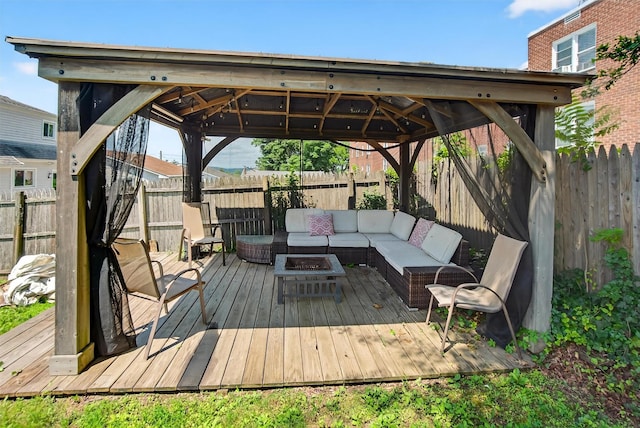 7 Fuller Rd, Ossining, NY 10562 - wooden terrace with an outdoor living space with a fire pit, a gazebo, and a fenced backyard